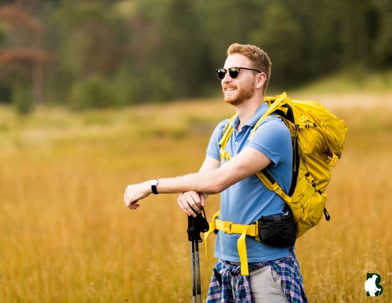 Sustainable traveler hiking through forest with eco gear, 2025